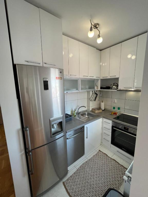 Kuchyň nebo kuchyňský kout v ubytování Apartman MIA Centar