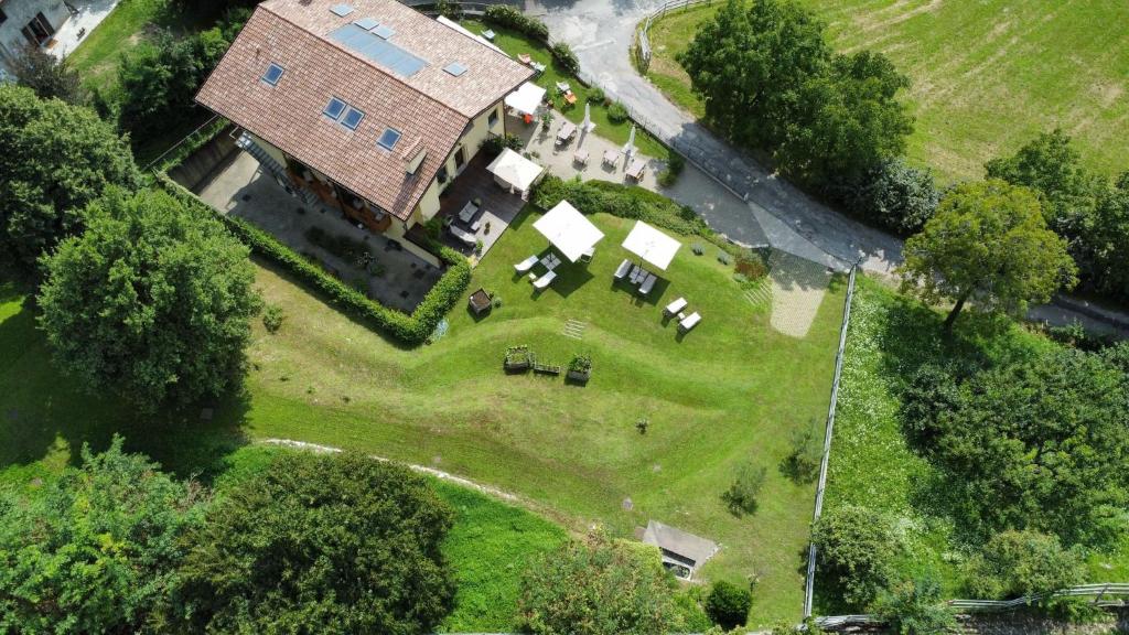 an overhead view of a large house on a grass field at Agriturismo Deviscio in Lecco