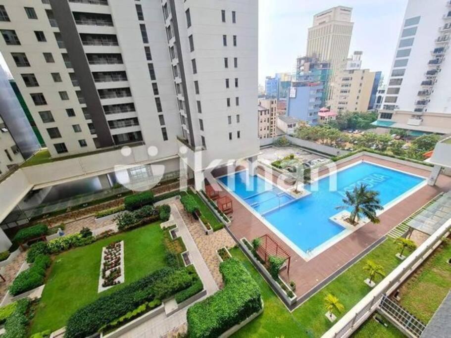 an apartment with a swimming pool in the middle of a city at Luxury Sea view fully furnished apartment in Colombo