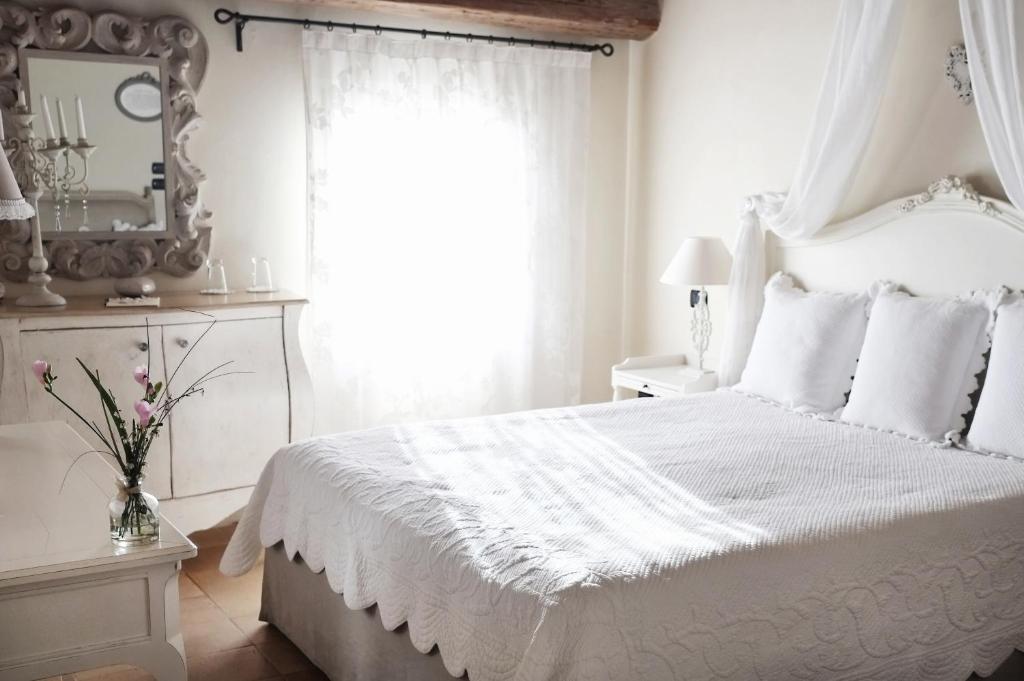 Postel nebo postele na pokoji v ubytování Casina Le Conserve