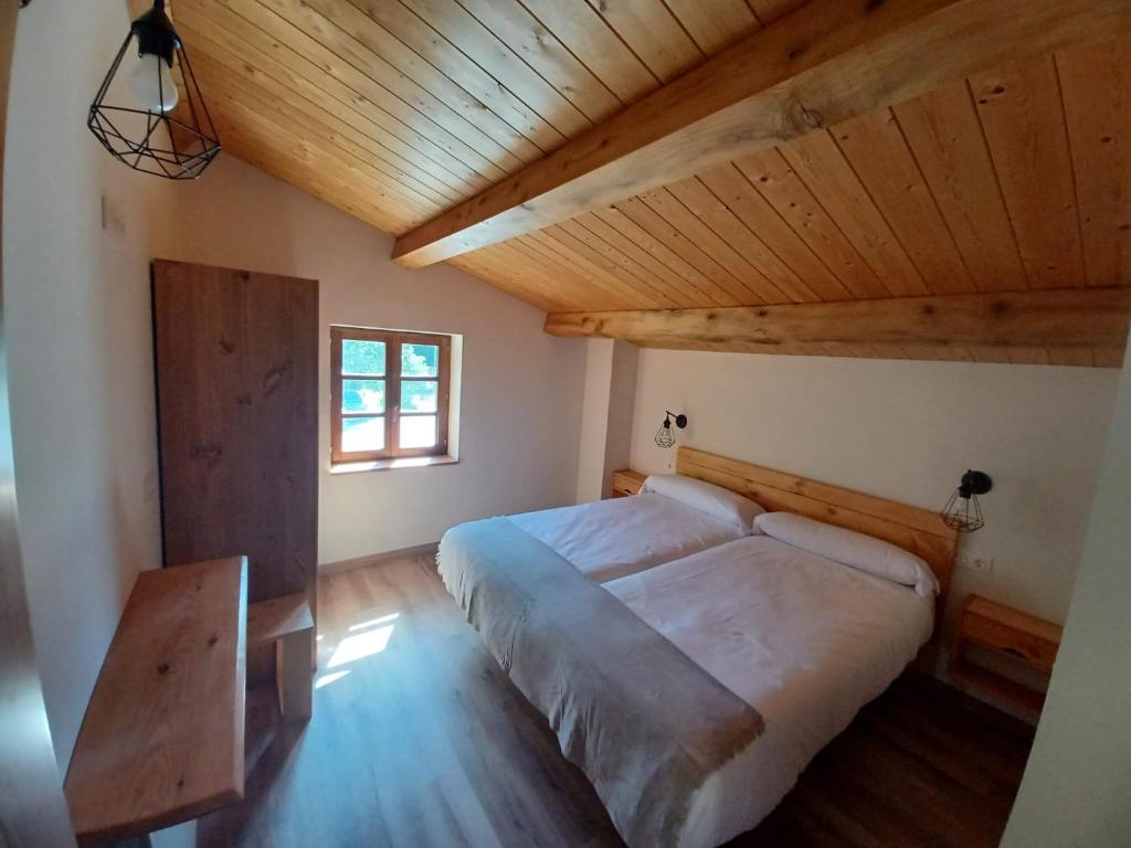 Postel nebo postele na pokoji v ubytování IRATIKO KABIAK