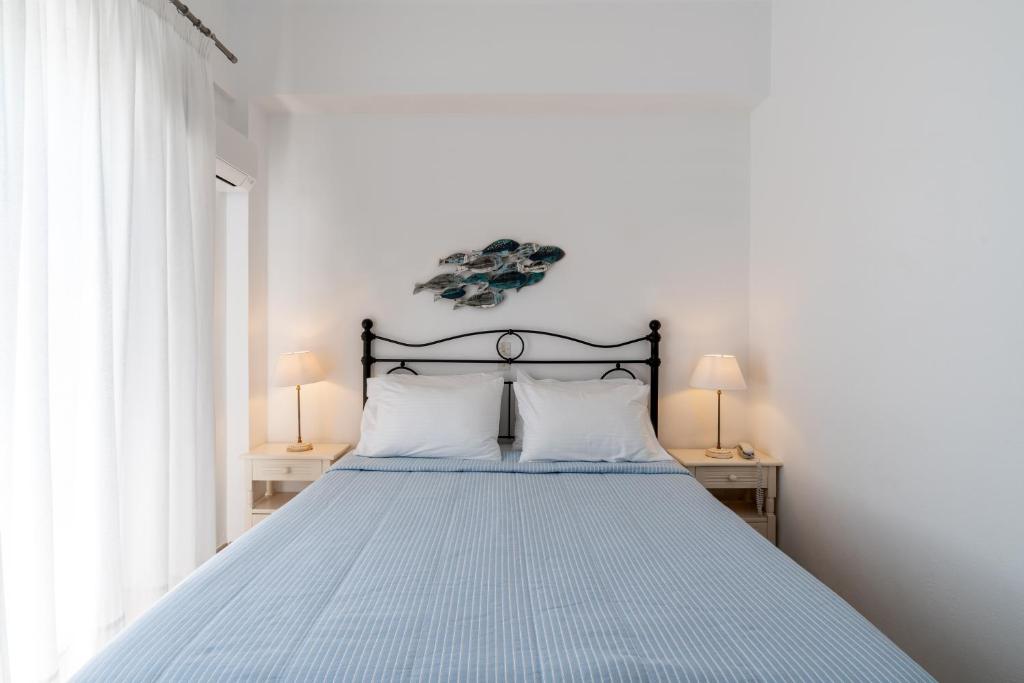 Een bed of bedden in een kamer bij Hotel Matina