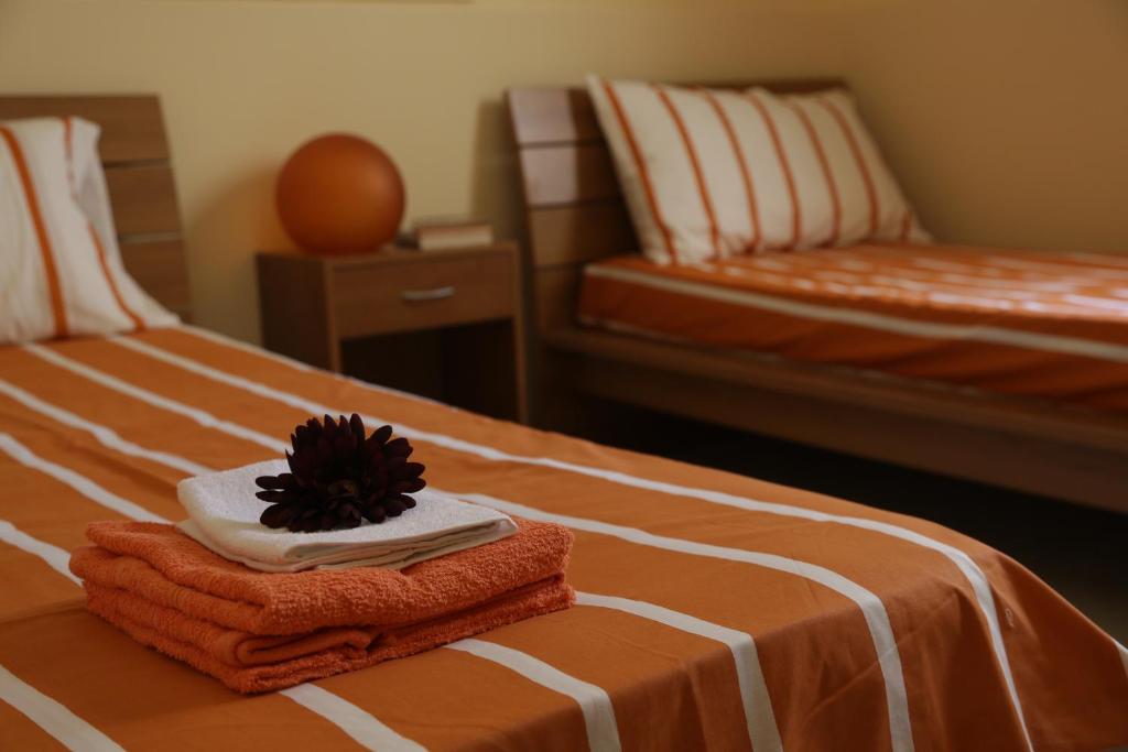 Łóżko lub łóżka w pokoju w obiekcie Apartment Inn
