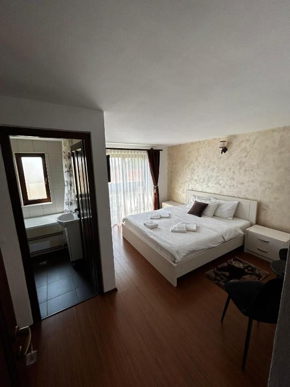 Postel nebo postele na pokoji v ubytování Casa Larisa