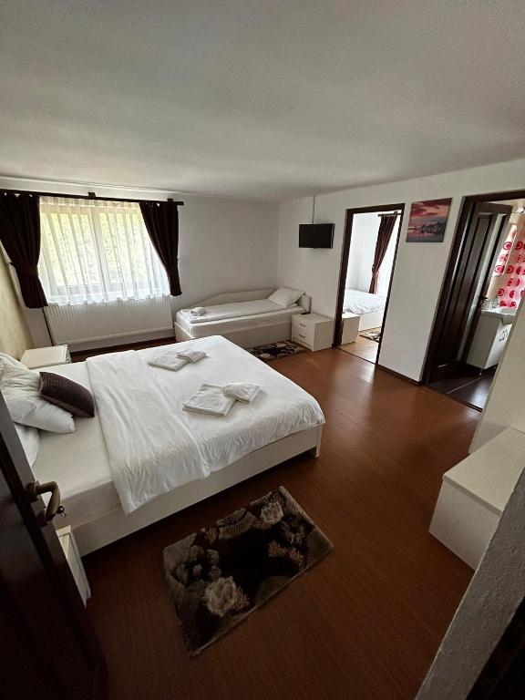 Postel nebo postele na pokoji v ubytování Casa Larisa