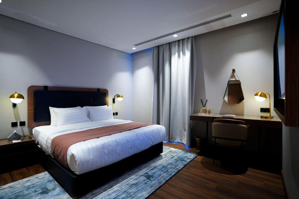 Postel nebo postele na pokoji v ubytování NAS Hotel