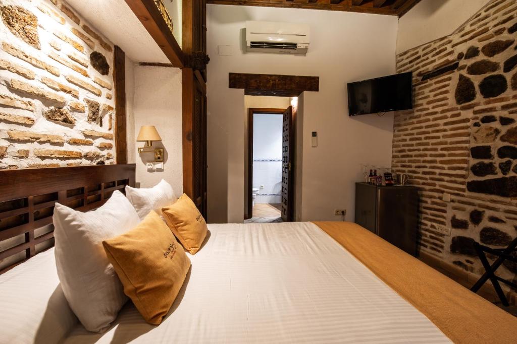 Postel nebo postele na pokoji v ubytování Entre Dos Aguas Hotel Boutique