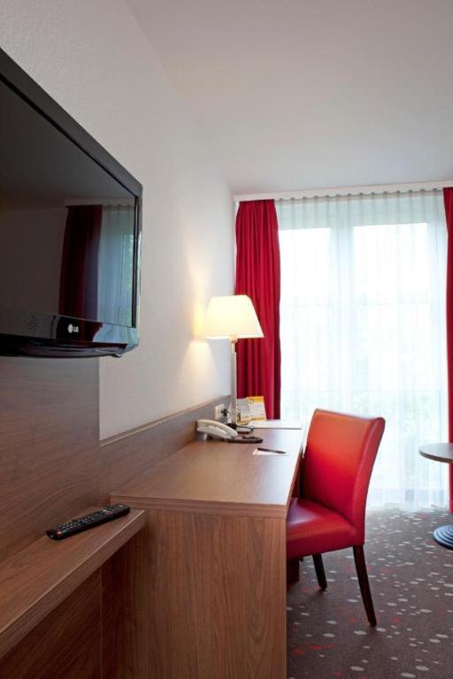 TV a/nebo společenská místnost v ubytování Best Western Hotel Erlangen