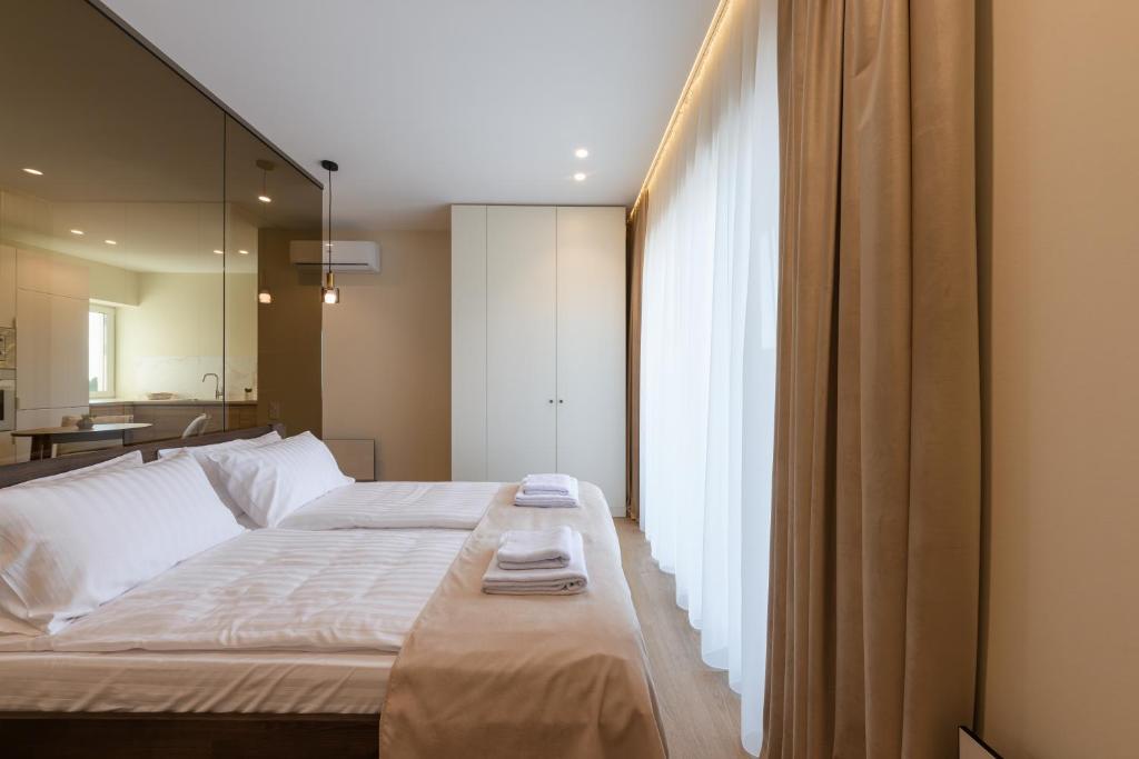 Postel nebo postele na pokoji v ubytování ММ GROUP APARTMENT