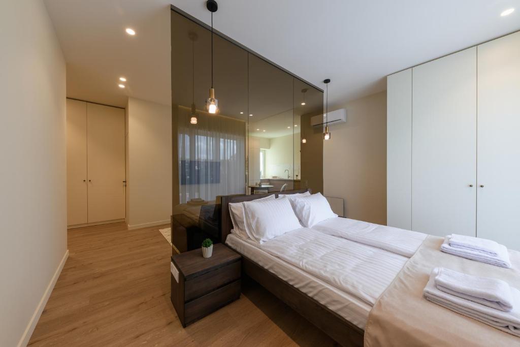 Postel nebo postele na pokoji v ubytování ММ GROUP APARTMENT