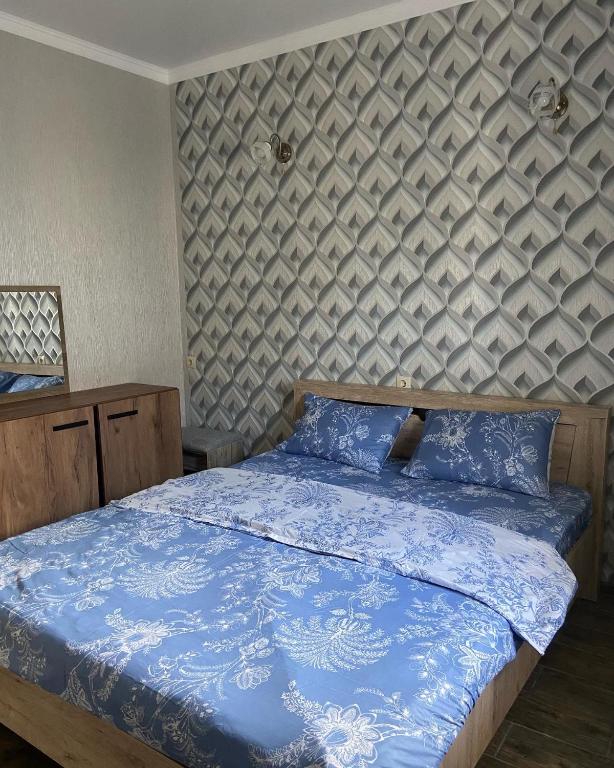 Postel nebo postele na pokoji v ubytování Уютный Дворик