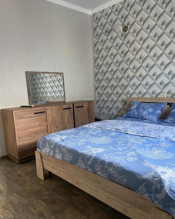 Postel nebo postele na pokoji v ubytování Уютный Дворик