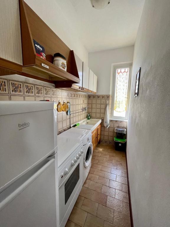 Kuchyňa alebo kuchynka v ubytovaní Casa Graziella