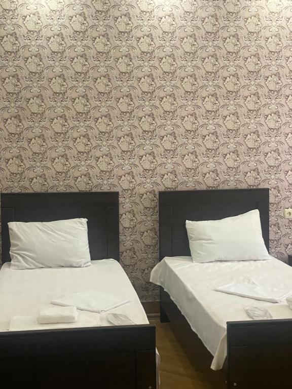 Postel nebo postele na pokoji v ubytování Hotel Mariana