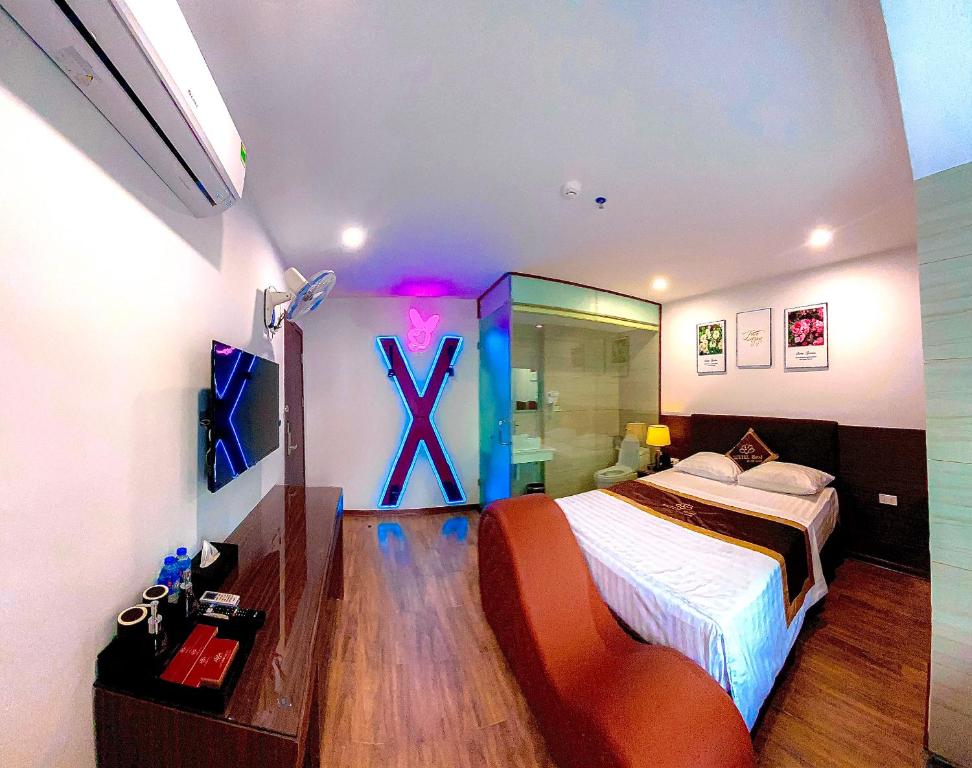 Postel nebo postele na pokoji v ubytování Luxtel Hotel Ngoại Giao Đoàn