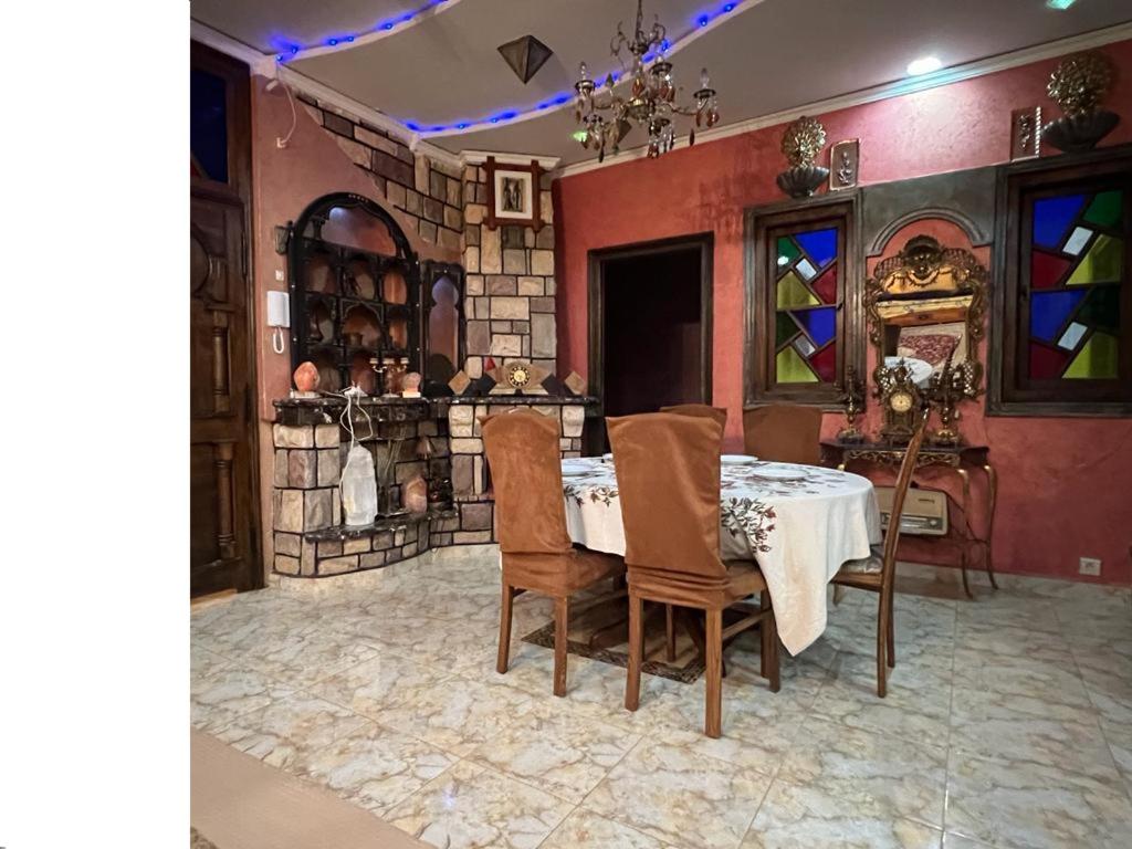 a dining room with a table and chairs at "Pearl in Middle Atlas" in Azrou