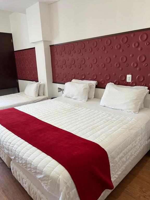 Postel nebo postele na pokoji v ubytování Hotel Florencia Plaza