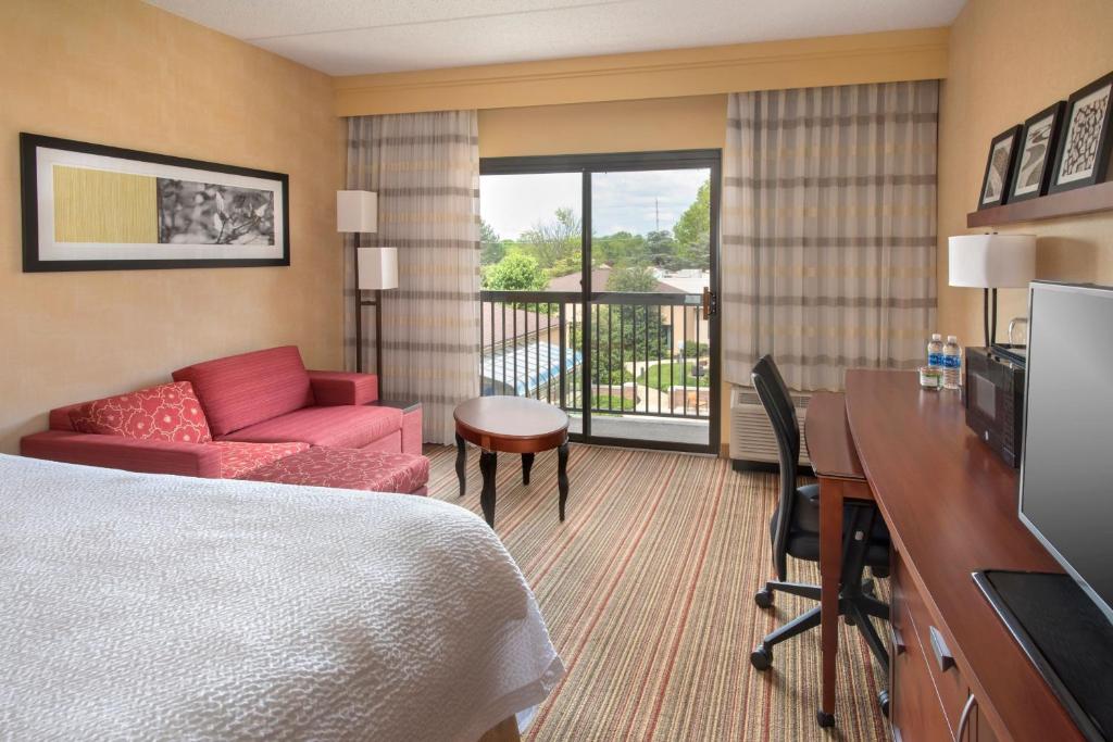 a hotel room with a bed and a desk at Courtyard by Marriott Mt. Laurel in Mount Laurel