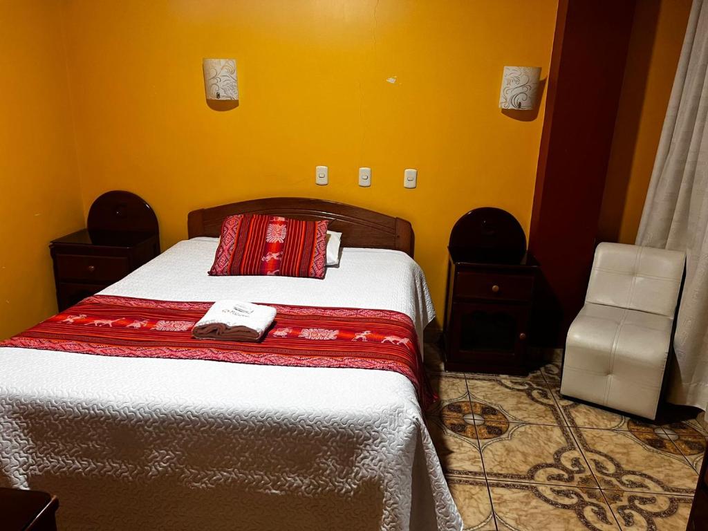 Postel nebo postele na pokoji v ubytování Hotel Colquewasi
