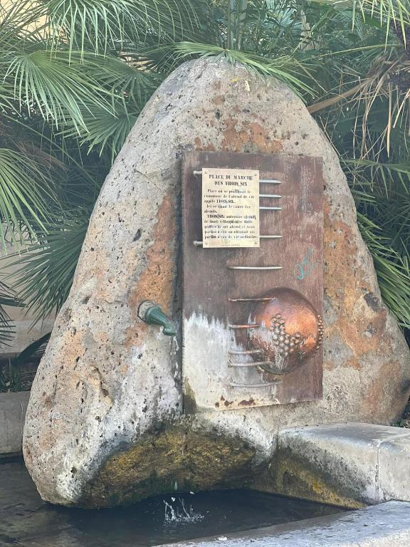 a statue of a rock with a door in it at Mes à Moi in Pezenas - Studio &amp; patio privatif - O Pitchoun in Pézenas