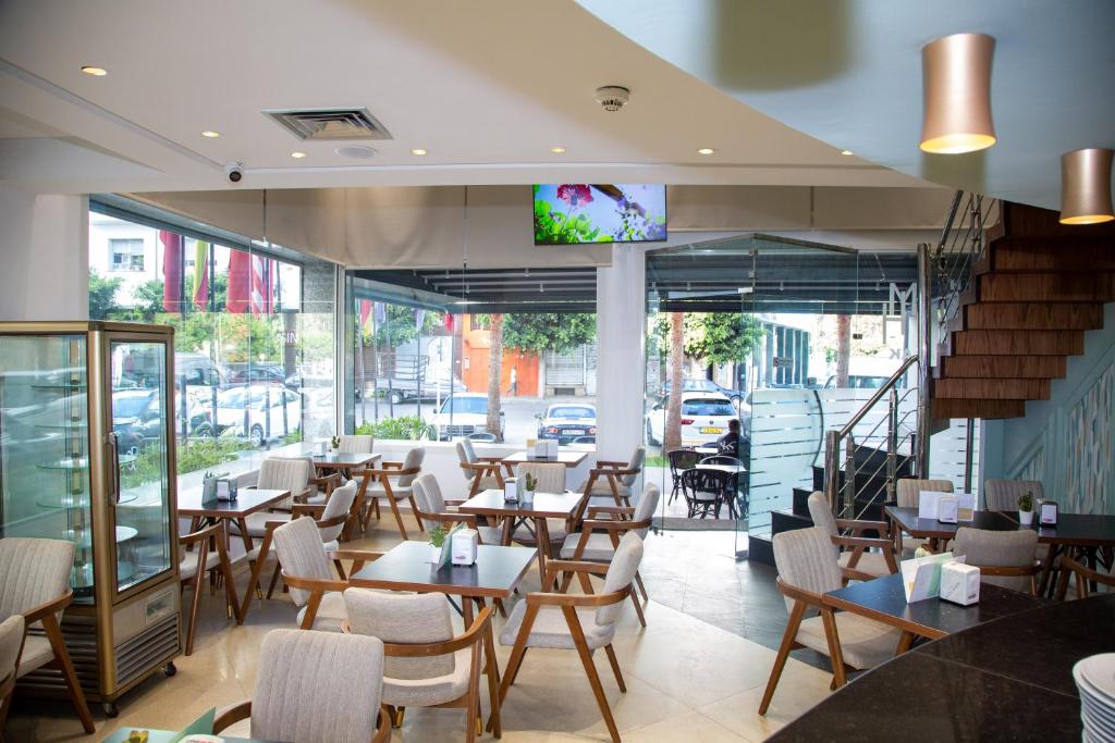 TV a/nebo společenská místnost v ubytování Malak Hotel