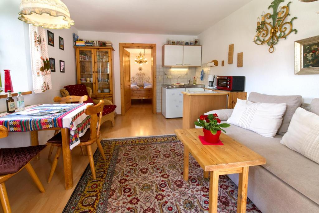 a living room with a couch and a table at Manuel -560- in Mittenwald