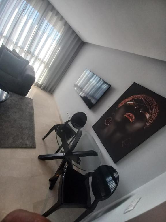 a room with a chair and a picture on the wall at Studio luxury casablanca in Casablanca
