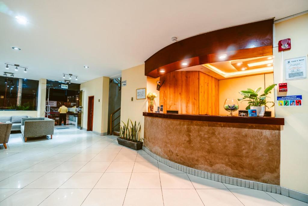 a lobby of a hospital with a reception counter at Cesar´s Hotel La Merced in Trujillo