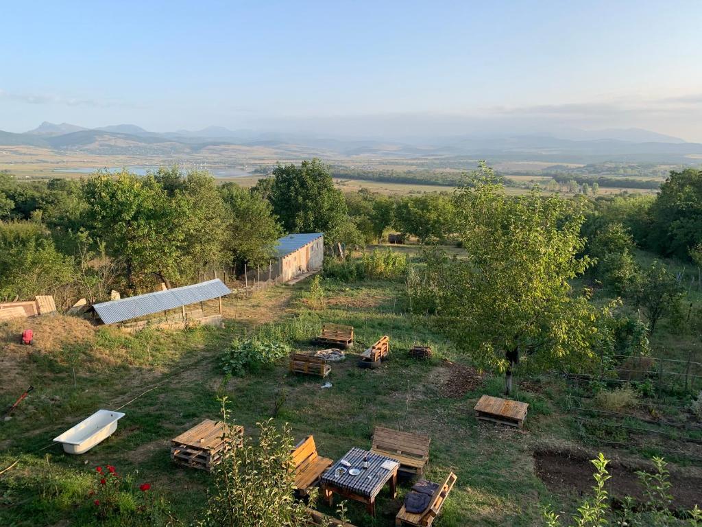 an aerial view of a field with tables and trees at Eco family guest house in Mlashe