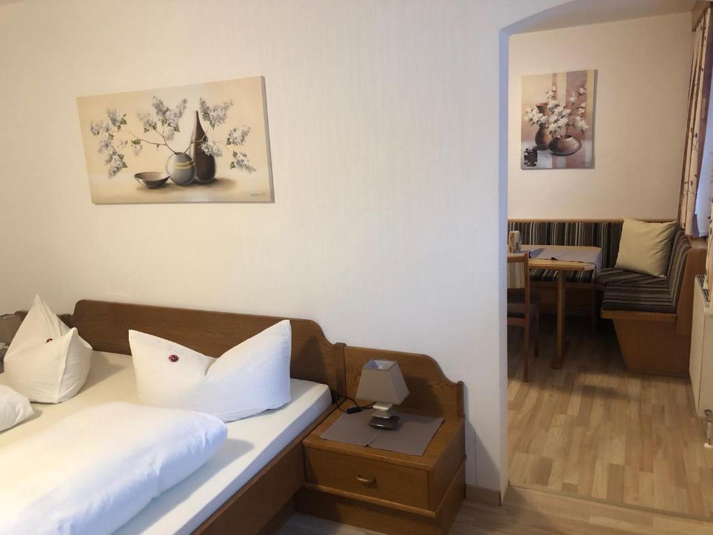 A bed or beds in a room at Gästehaus Koch