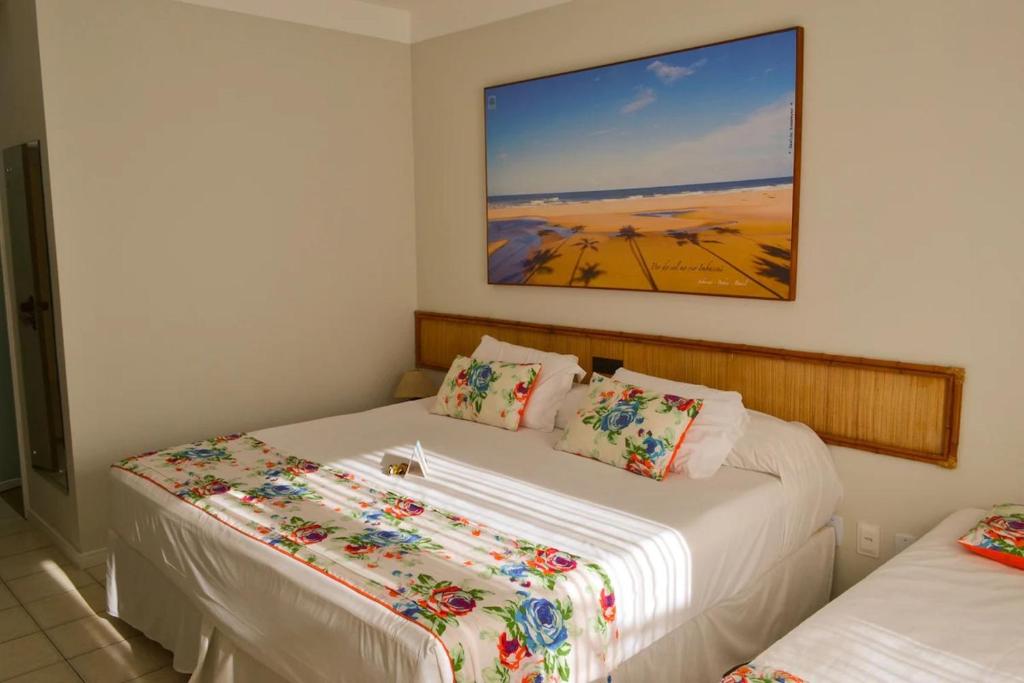 Postel nebo postele na pokoji v ubytování Resort Costa Dos Coqueiros
