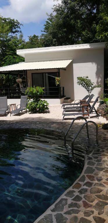 Bazén v ubytování EcoVillas Las Melinas nebo v jeho okolí