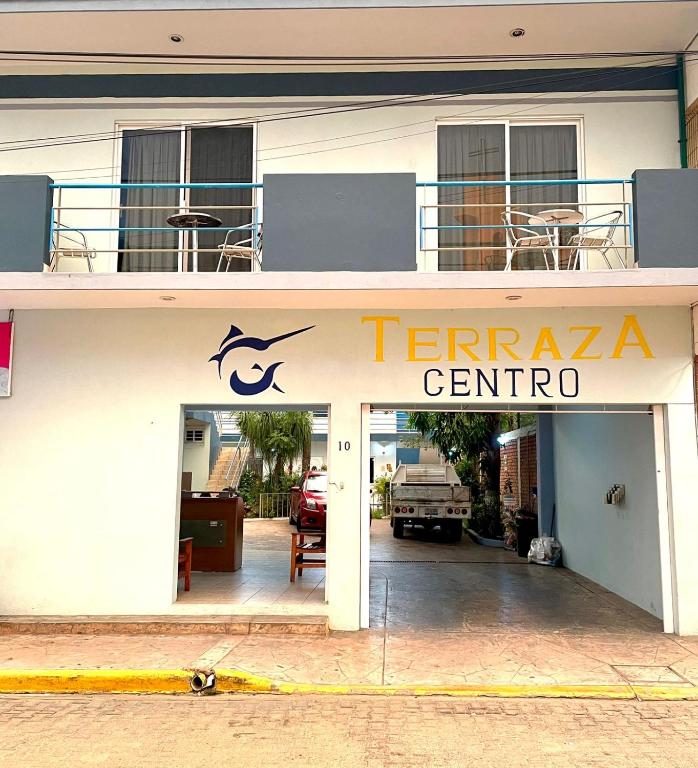 a building with a sign that reads temaria centro at Hotel Terraza Inn in Rincon de Guayabitos