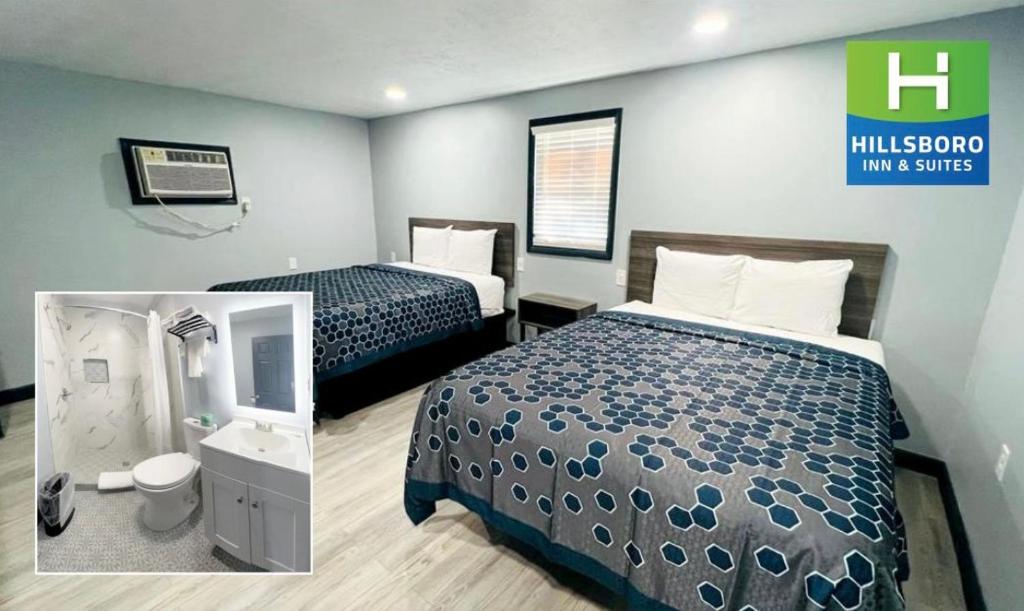 een hotelkamer met 2 bedden en een badkamer bij Hillsboro Inn & Suites in Hillsboro