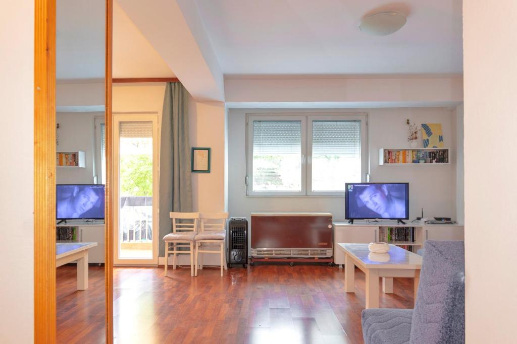 a living room with a couch and a table at Two bedroom apartment near centre in Ohrid