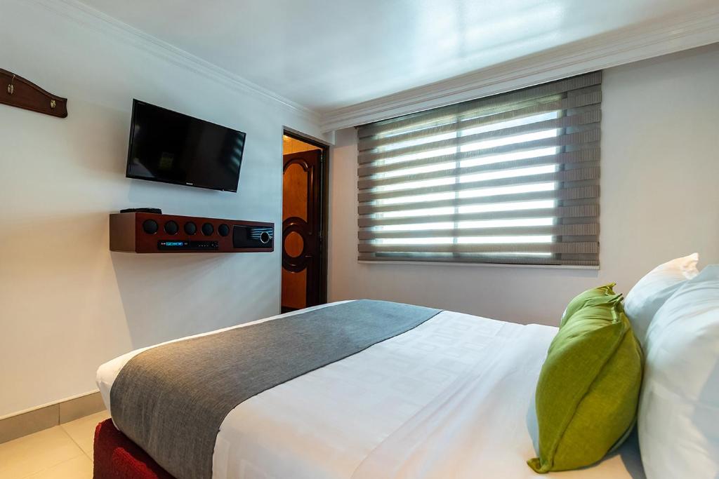 Postel nebo postele na pokoji v ubytování Lavid Hotel Palacio Real