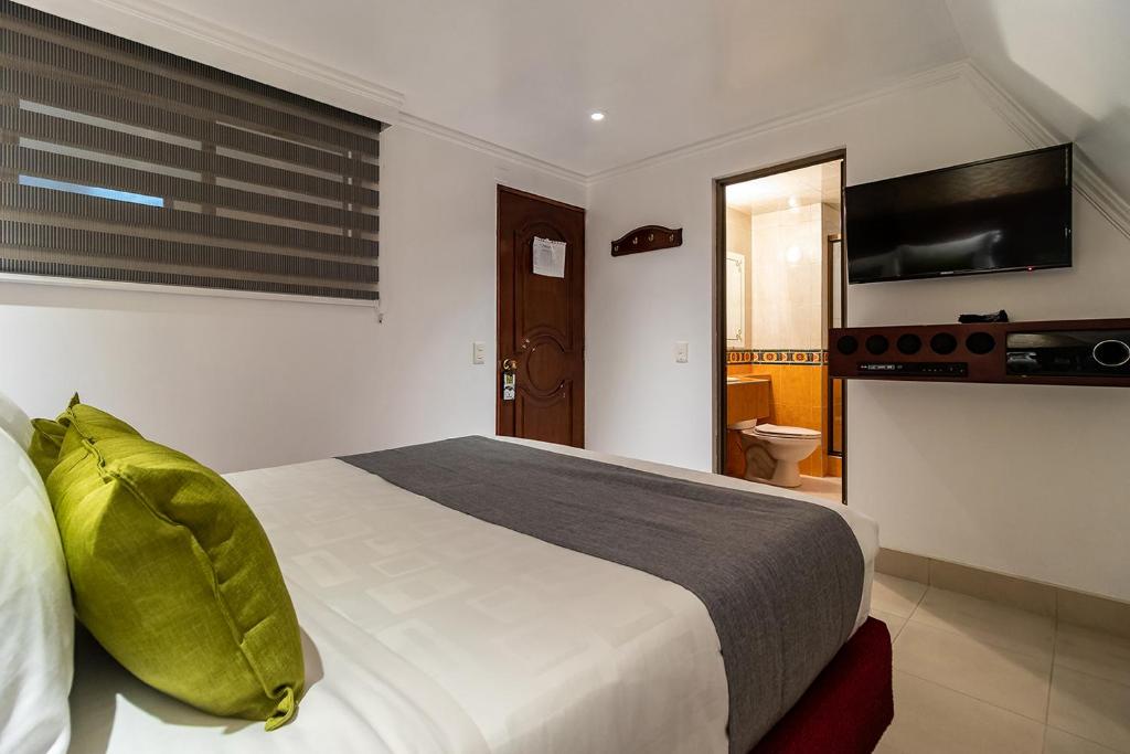 Postel nebo postele na pokoji v ubytování Lavid Hotel Palacio Real