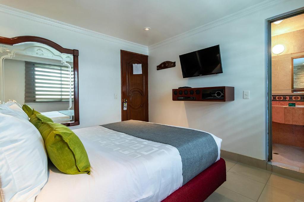 Postel nebo postele na pokoji v ubytování Lavid Hotel Palacio Real