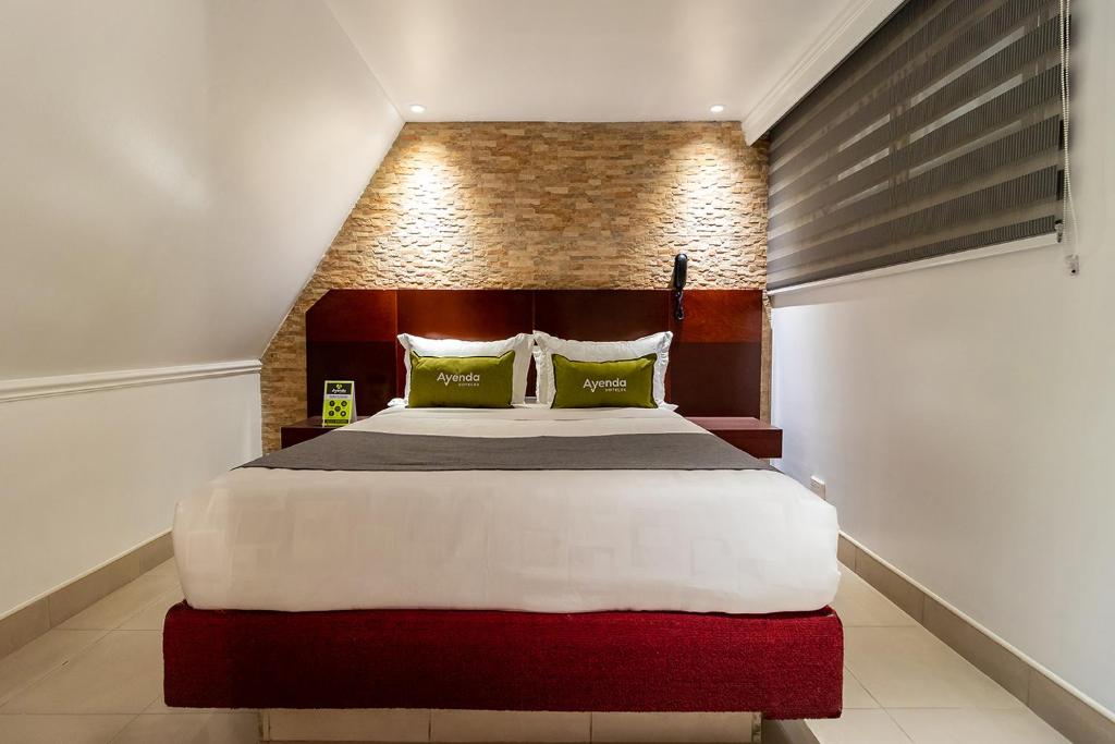 Postel nebo postele na pokoji v ubytování Lavid Hotel Palacio Real