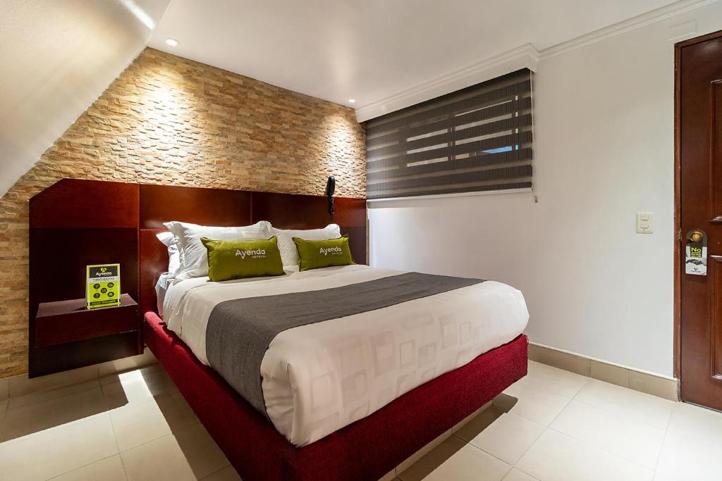 Postel nebo postele na pokoji v ubytování Lavid Hotel Palacio Real