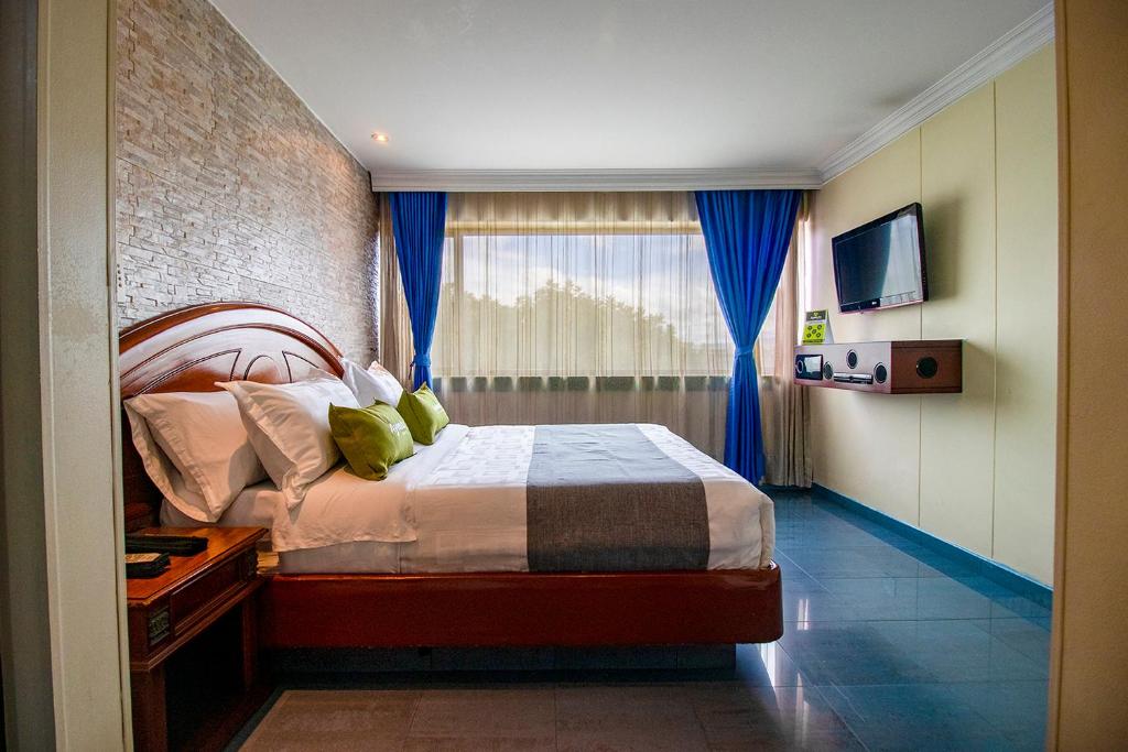 Postel nebo postele na pokoji v ubytování Lavid Hotel Palacio Real