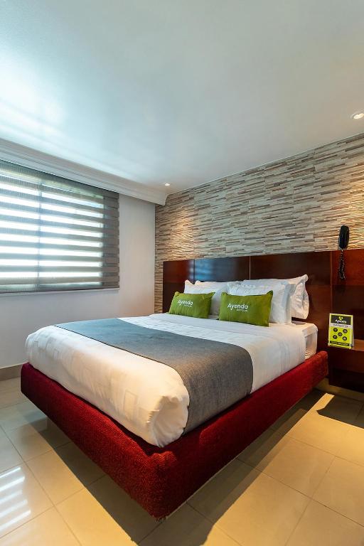 Postel nebo postele na pokoji v ubytování Lavid Hotel Palacio Real