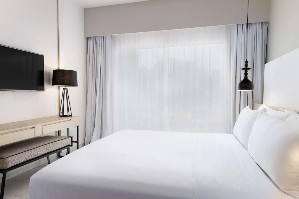 Postel nebo postele na pokoji v ubytování Radisson Blu Residences, Saidia