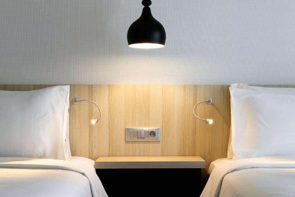 Postel nebo postele na pokoji v ubytování Radisson Blu Residences, Saidia
