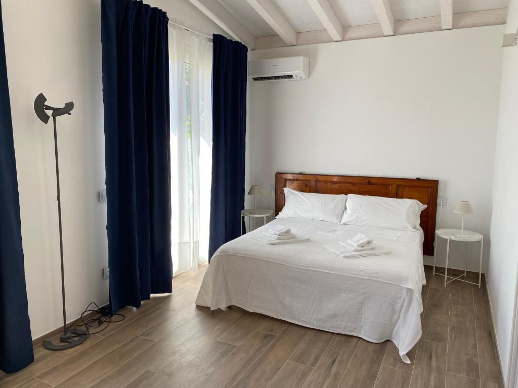 Кровать или кровати в номере Belvedere Residenza Mediterranea