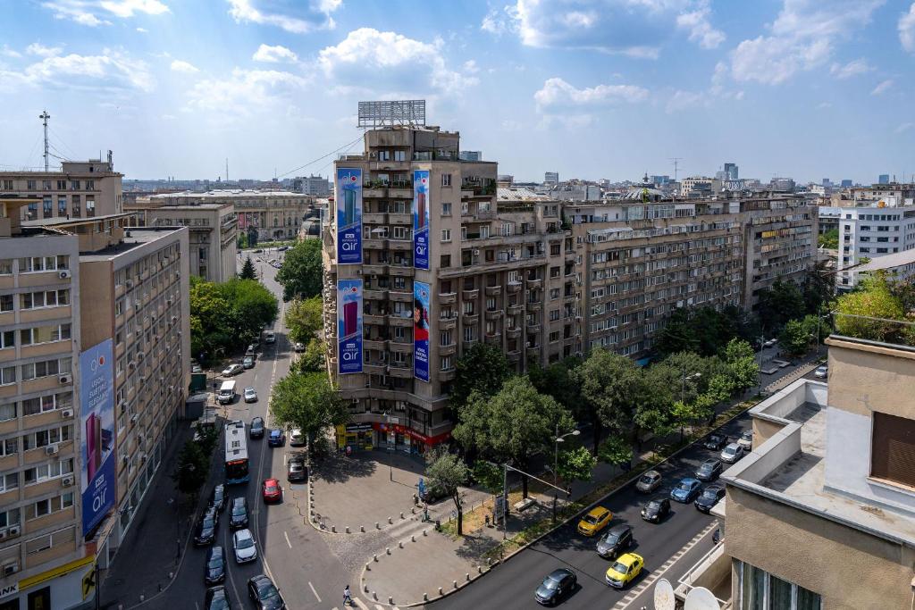 an aerial view of a city with buildings and cars at CityHeart Studio in Bucharest