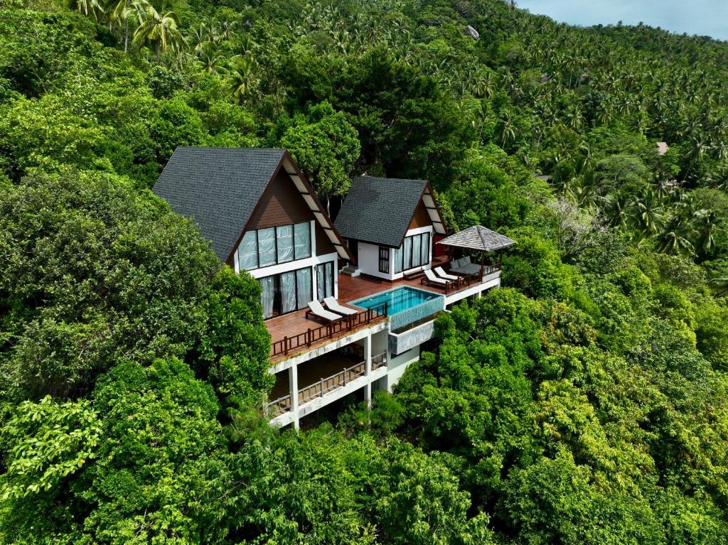 an aerial view of a house in the middle of a hill at Taoruna Villa in Koh Tao
