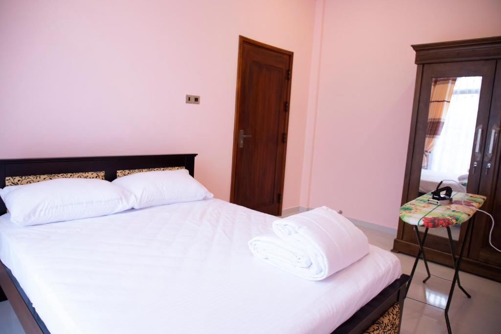 Postel nebo postele na pokoji v ubytování WIMAL PALACE