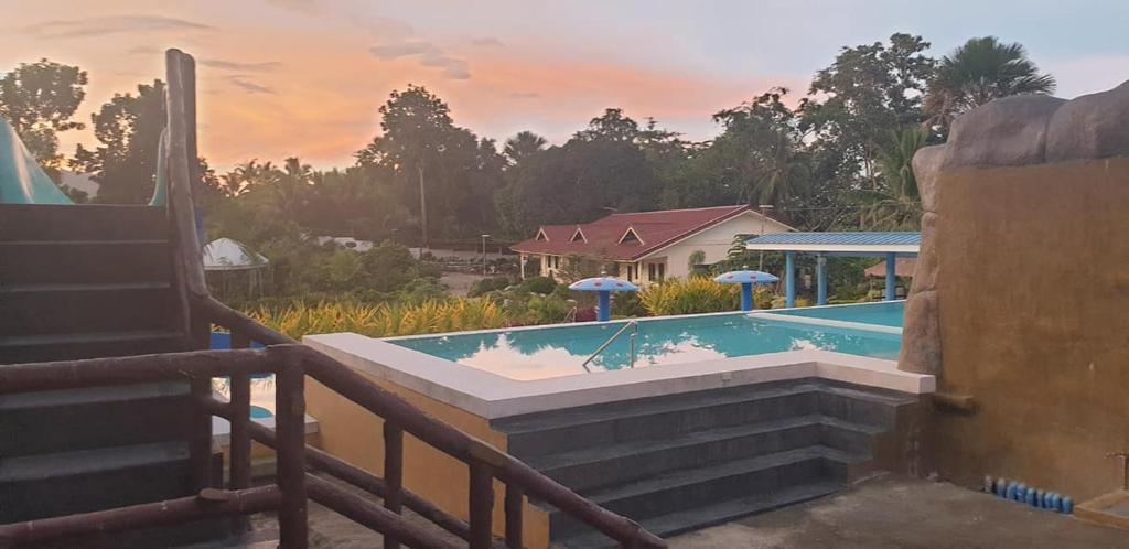 a view of a swimming pool from the balcony of a house at Bigin Garden View Resort 