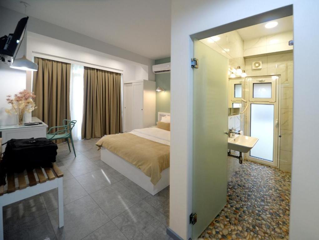 Letto o letti in una camera di konak rooms l Skanderbeg Square